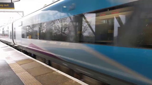 TPE 68023 and Set 7 passing Newton Le Willows