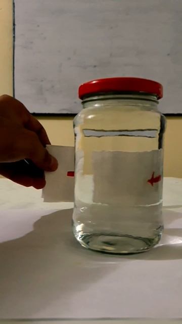 The arrow looks like it has changed direction bcause of refraction. #magicofscience #gurjeetsguidin
