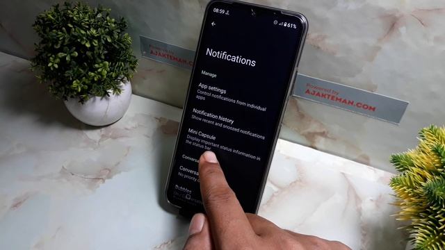 How to turn on mini capsule on realme note 50