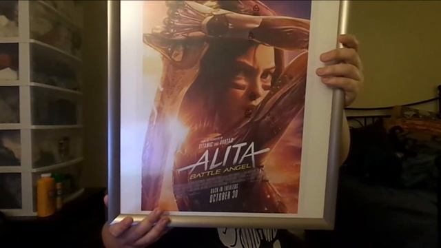 Two Poster Frames (2021): Alita: Battle Angel (2019) & Mad Max Fury Road (2015)