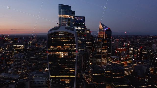 Fly around group of skyscrapers in modern business district. Evening aerial view of city. London, U