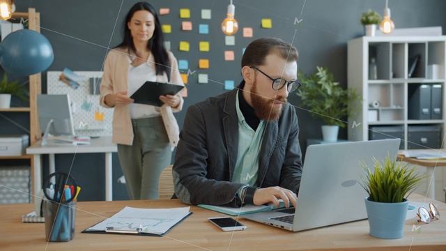 Businesswoman approaching colleague in office discussing document talking