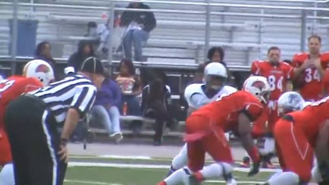 Chicago Colts slot receiver Courtney Ousley runs for some yardage...