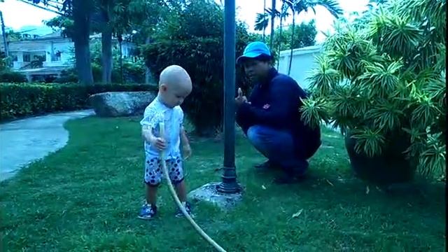 Baby with water in Thailand