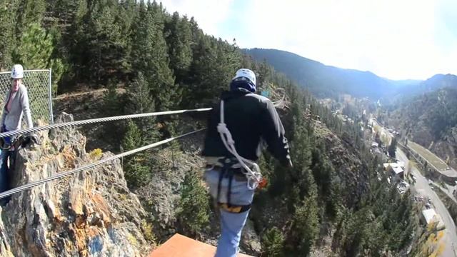 Guide Jumps off Zipline | AVA Zipline Adventures Idaho Springs, CO