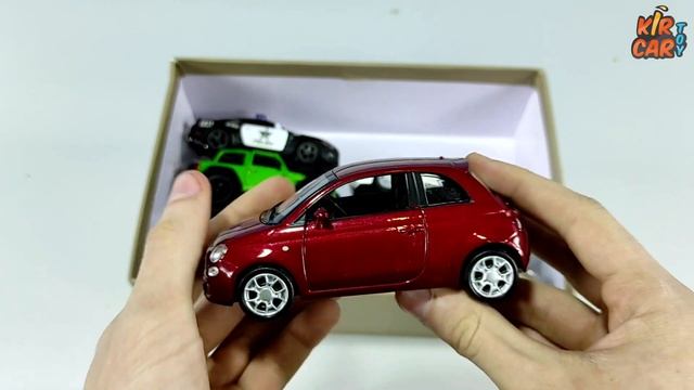 Box full of toy cars models. Kir Car Toy