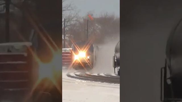 Fast Amtrak Train Passes Slow Freight Train