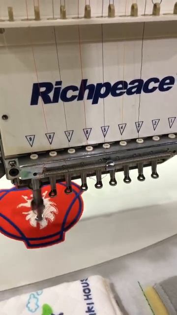 Stitching Sewing Embroidery Quilting machine is doing testing for logos