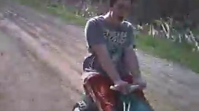 Jon riding his little tractor.