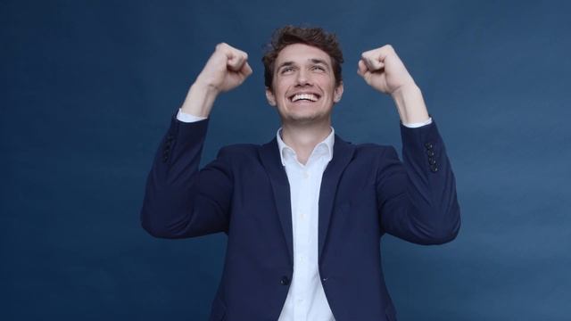 handsome man in business suit showing his 8BQCZ39