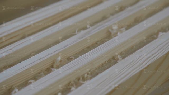 Production of laminated veneer lumber: mechanized production