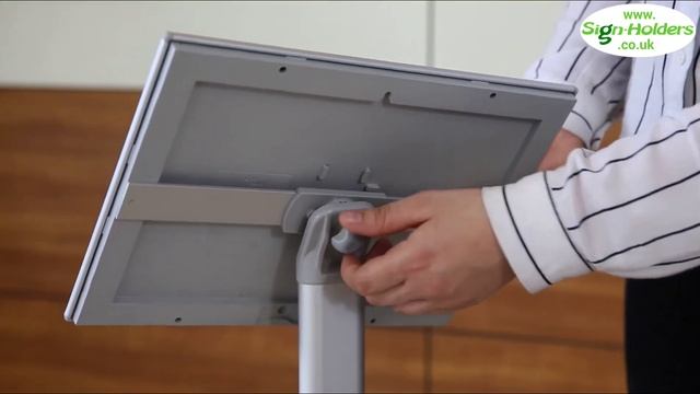 Angled poster stand assembly