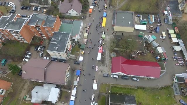 Flight Over Small Town, Fair On Street 1 - cutestockfootage.com