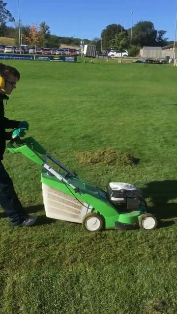 Kyle lifting thatch using the Viking rotary mower