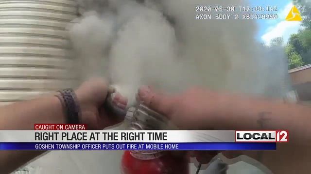 Caught on Camera: Goshen Township officer puts out fire at mobile home