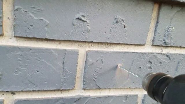 How to install a garden hose hanger on to concrete or brick