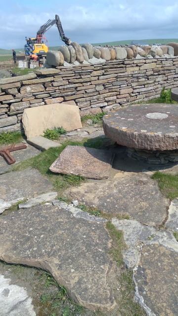 by  the beach, aboveground at Skara Brae neolithic village May 21, 2023
