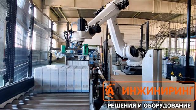Укладка пачек в групповой упаковке на паллету Роботом и упаковка в стретч пленку