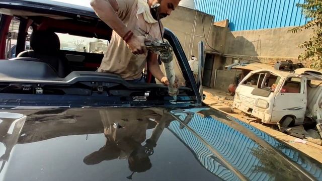 Some rioters broke all the glass of this Scorpio S11