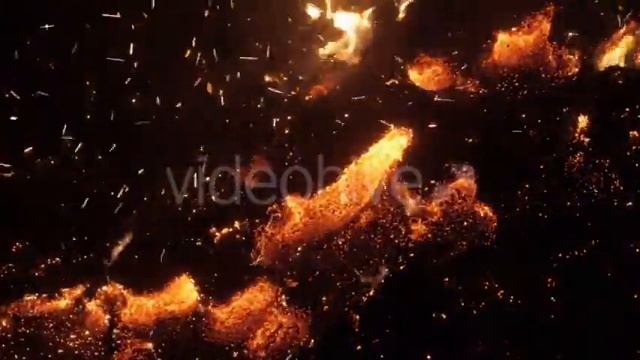 Many Fire Sparks Rising up From Bonfire Smoldering Dry Tree Leaves