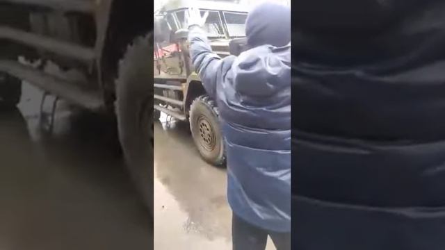 Civilians blocking the passage of another Russian column