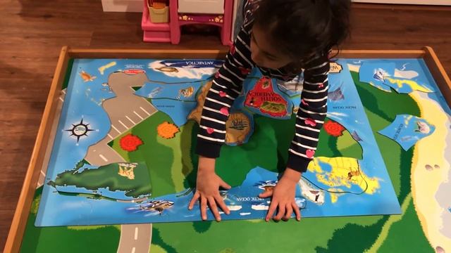 Aarna having fun with World map puzzle game (Melissa & Doug World Map)