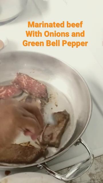 Marinated Beef With Onions and Green Bell Pepper.