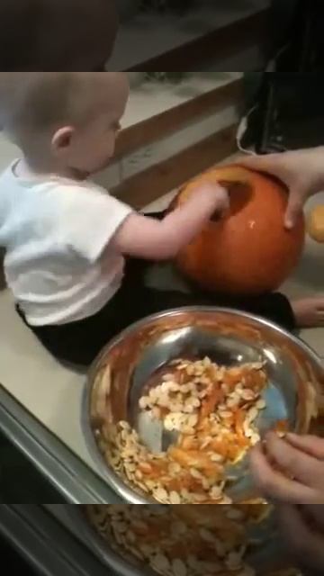 Grant helping carve a pumpkin 2