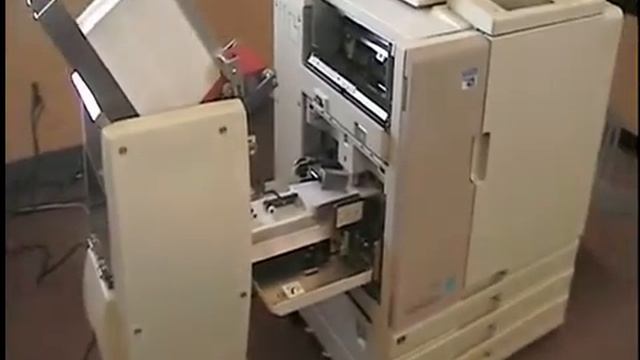 Thompson T-100D Envelope Feeder on Riso 7050R ComColor