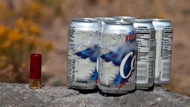 12 gauge Shotgun Blows up 6-pack of Soda!