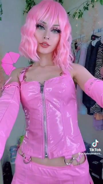 Cute girl showing her pink pvc latex outfit