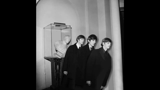 The Beatles posing with a Napoleon bust Paris 1964