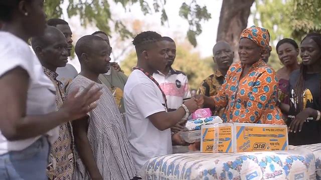 Donating sanitary pads, exercise books, and pens to the Loloto community.