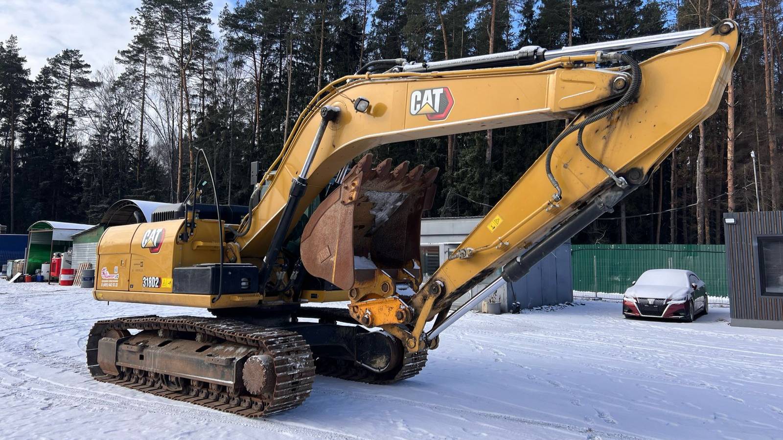 Экскаватор CAT 318 D2 L в работе – мощь и точность