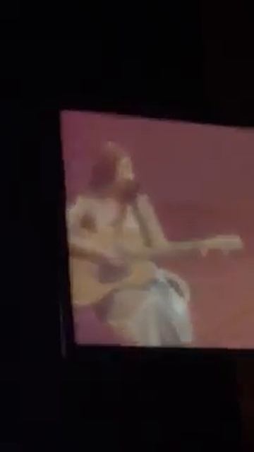 Jennie playing guitar