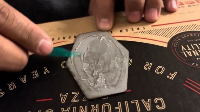 Using E6000 to Glue a Leather Patch on a Hat.