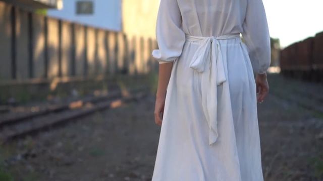 Woman Walking and Turning Around Looking at Camera