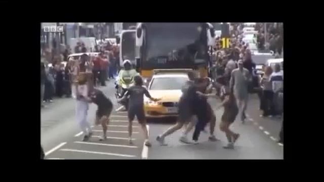 Muslim Teen shouts  Allahu Akbar  as he tries to grab the Olympic flame (Low)