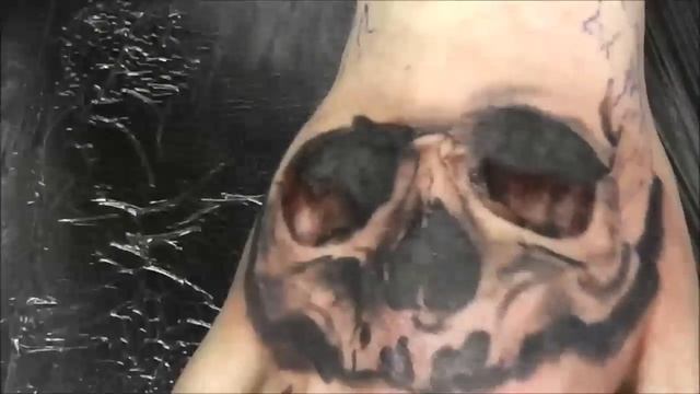 Timelapse skull tattoo on the hand.