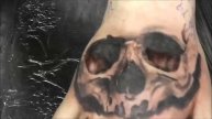 Timelapse skull tattoo on the hand.
