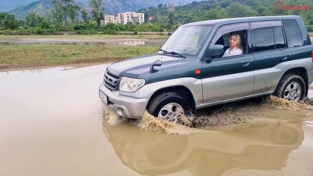 car stuck in mud muddy road hard pedalpumping