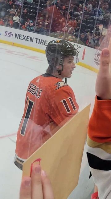Trevor Zegras flips puck to kid