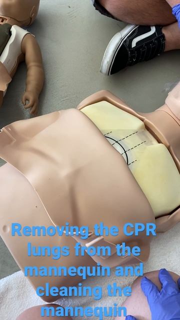 Removing CPR lungs from the mannequin and cleaning the mannequin