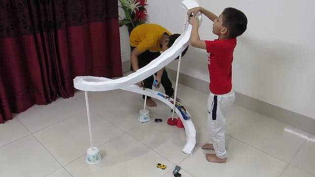 Kids playing with homemade car race track
