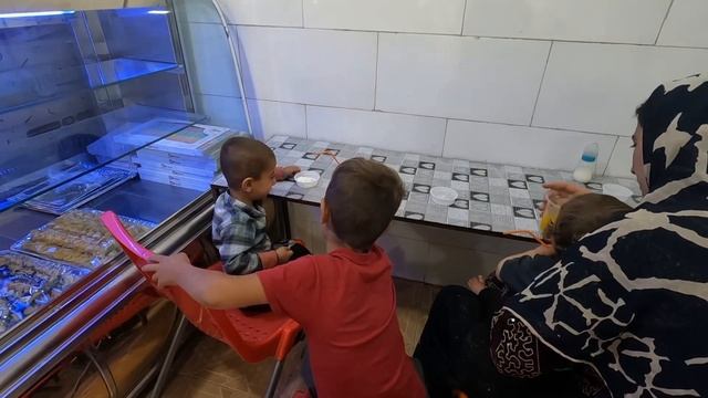 The grandfather's kindness towards Zahra and his children bought clothes