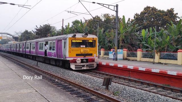 Classic crossing of EMU local Train Train in a Dazzlingly colorful Dusk