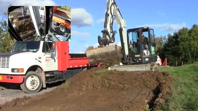Bobcat E50 with Hydra-Tilt Attachment Loading Truck