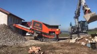 Derbaggerer Bauschutt brechen arjes impaktor 250 hitachi zx 170