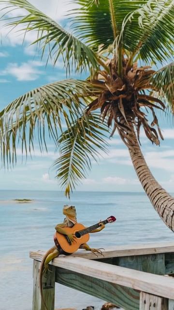 Ящерица играет на гитаре