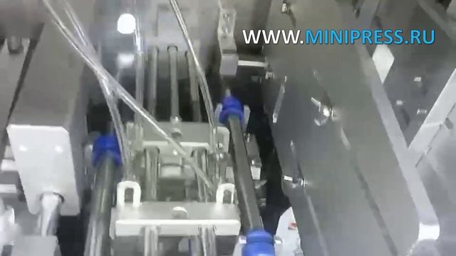 Розлив жидкостей в дой-пак пакеты на автоматической машине DG-18 Minipress.ru